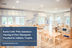 Bright and welcoming preschool classroom with child-sized wooden tables, chairs, and learning stations. A mural of whales decorates the walls. Overlay text reads, “Karter Little Wins Announces Opening of First Therapeutic Preschool in Ashburn, Virginia” with the website karterschools.com.
